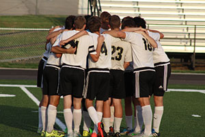 The Varsity Soccer Team has a pep talk at the home game against Baldwin on Sept 1. 2015. The game was the second game on the new turf. 