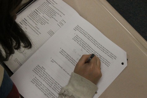 Chloe Rauch, 10, writing her answer about why Macbeth brought the daggers out of Duncan’s chamber in English on April 14th.