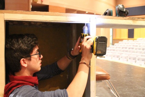 Gaylin Nicolson, 12, drilling a screw in to finish up the counter that is going to be used for the play Steel Magnolias in technical theater on April 15th.