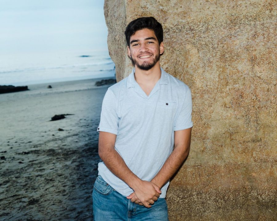 Caption: Mason Escobar poses for a photo during his senior photo shoot. Escobar plans to use what he has learned in high school and what he will learn in college and give back to those around him.
“I want to achieve peace of mind whenever possible, and I feel that in my old age, if I haven’t given back the same or greater amount of good to the world that I borrowed from it, I won’t feel at peace in my own mind,” he said. “I think any career path I choose will have to be one that allows me to give back to the world in some form.”
