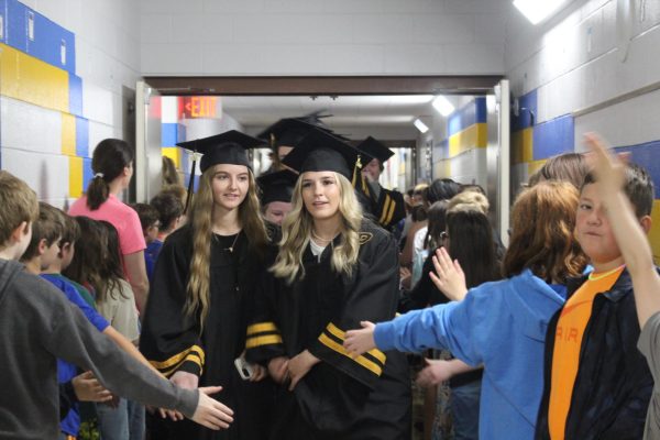 Seniors walk through elementary schools as part of pre-graduation tradition